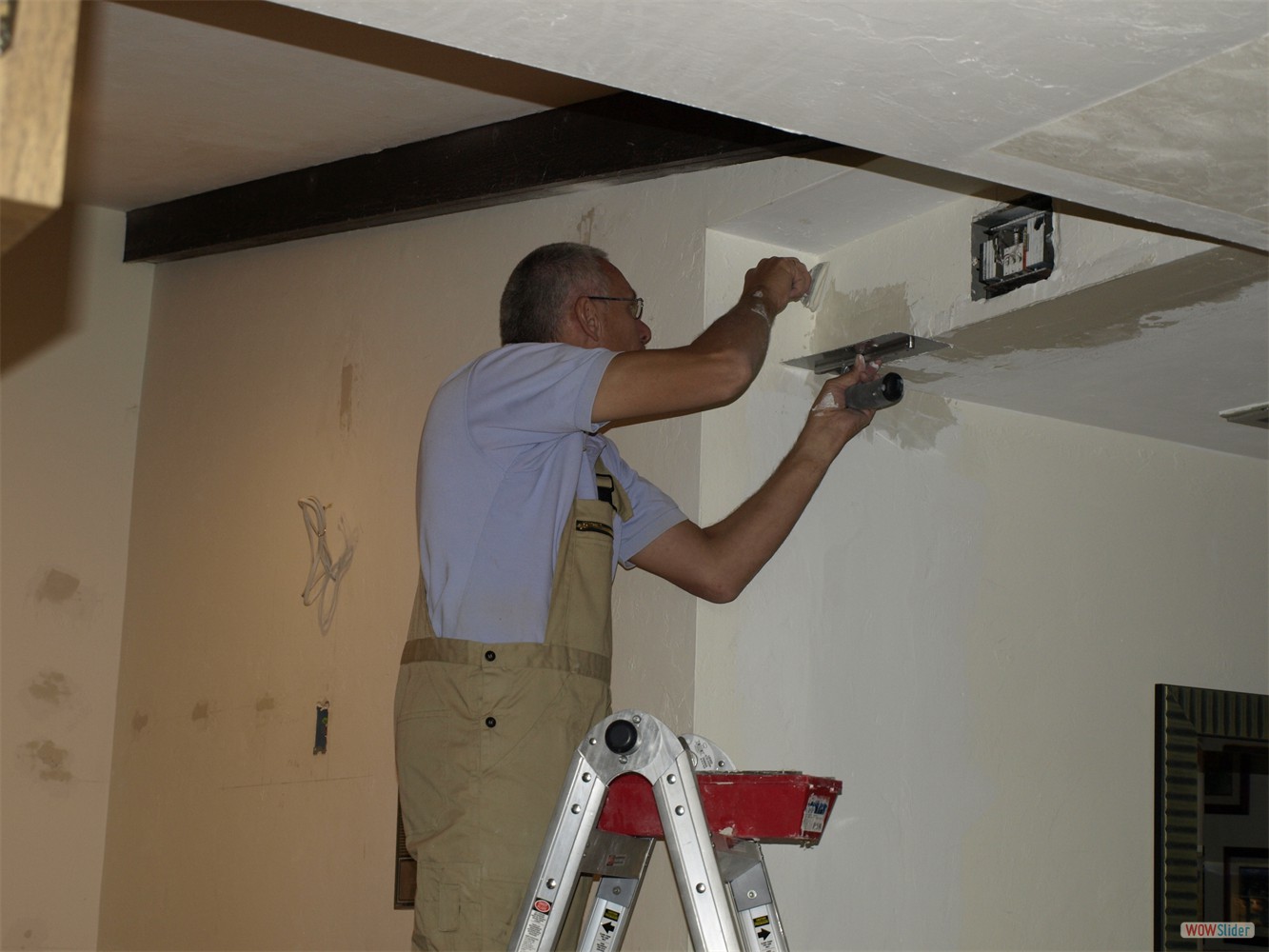 Juergen plastering the enlarged opening to the hall