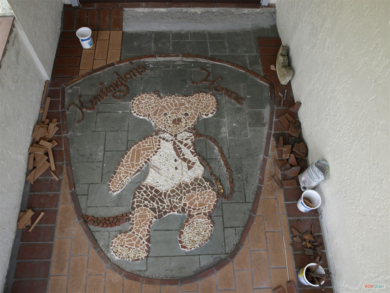 ... when she put down a mosaic showing the name of our house ...